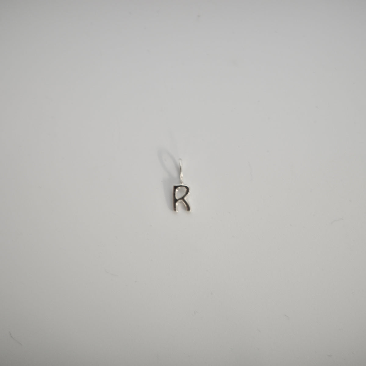 INITIAL CHARM